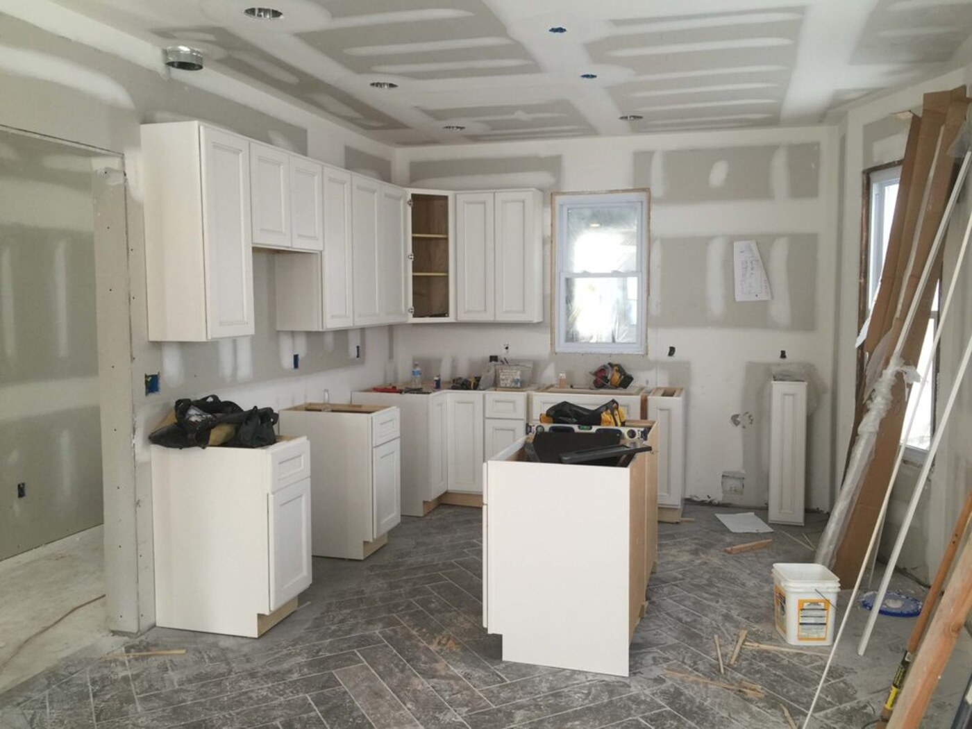 Base cabinets and island going in on a kitchen install